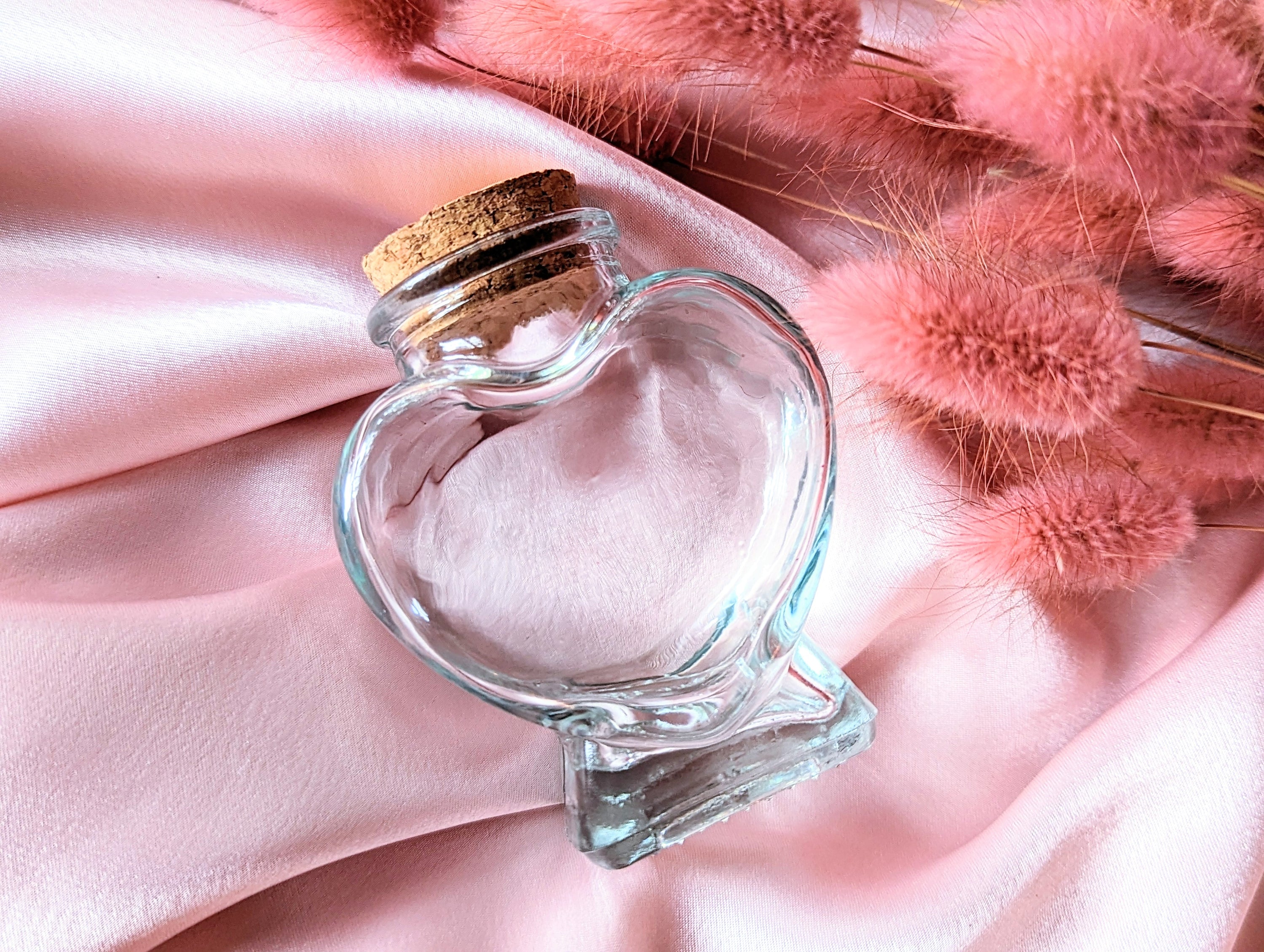 Divine Love Ritual Kit by Goddess Provisions featuring dried flowers, rose quartz, and a heart-shaped jar.