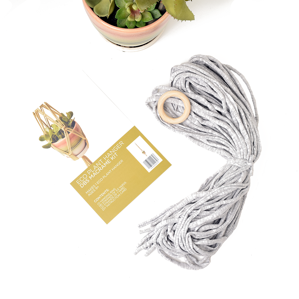 DIY Eco Macramé Plant Hanger Kit with eco-friendly materials and colorful cords displayed on a wooden surface.