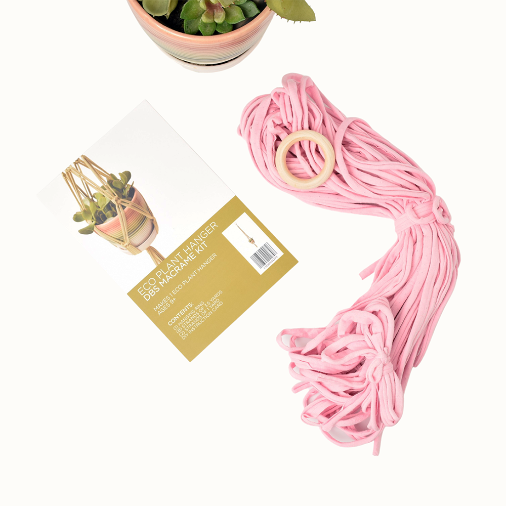 DIY Eco Macramé Plant Hanger Kit with eco-friendly materials and colorful cords displayed on a wooden surface.