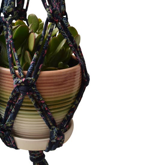 DIY Eco Macramé Plant Hanger Kit with eco-friendly materials and colorful cords displayed on a wooden surface.