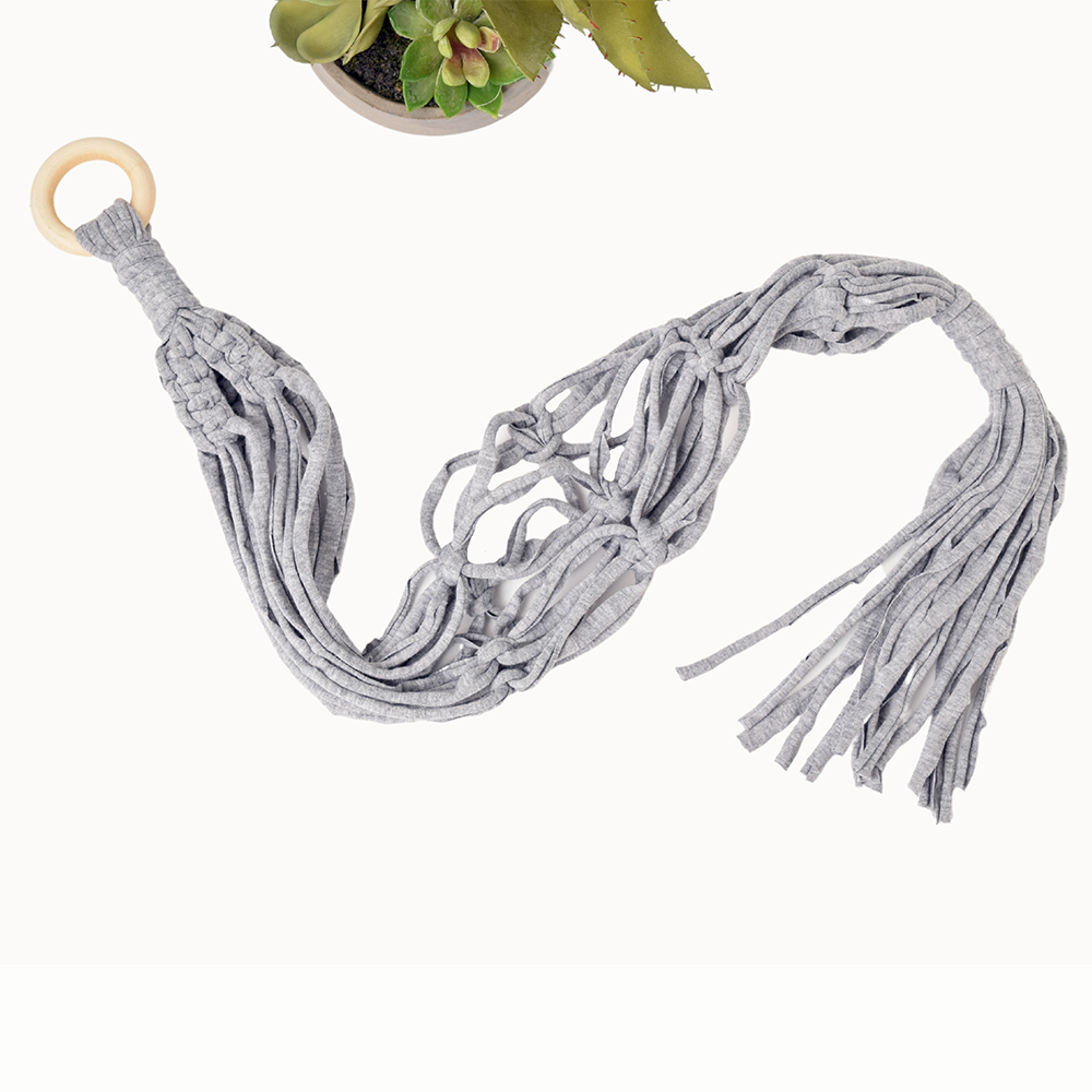 DIY Eco Macramé Plant Hanger Kit with eco-friendly materials and colorful cords displayed on a wooden surface.