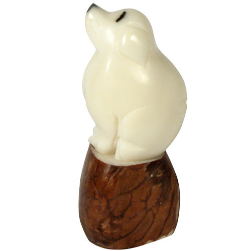 Handcrafted Dog Tagua Nut Pet Figurine, showcasing intricate details and natural colors, symbolizing eco-friendly craftsmanship.