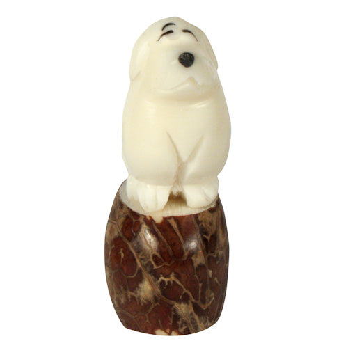 Handcrafted Dog Tagua Nut Pet Figurine, showcasing intricate details and natural colors, symbolizing eco-friendly craftsmanship.