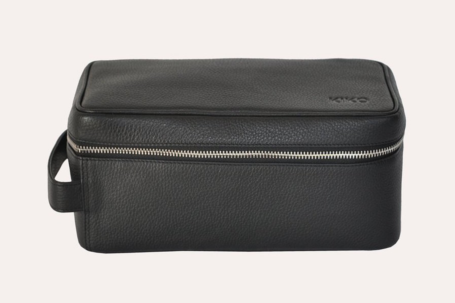 Elegant Dopp Kit made from premium leather with a carrying handle and zipped netted storage area.