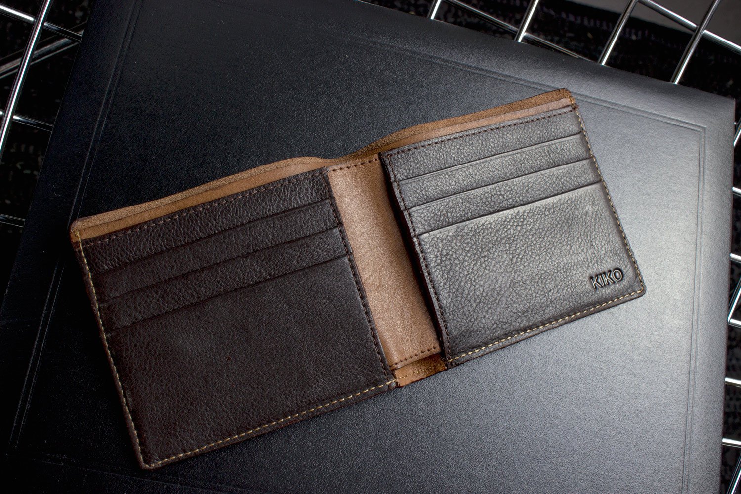 A stylish Double Bifold Wallet made from soft cowhide leather, featuring a double bill compartment and six card slots.