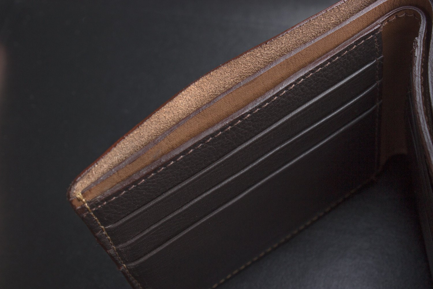 A stylish Double Bifold Wallet made from soft cowhide leather, featuring a double bill compartment and six card slots.