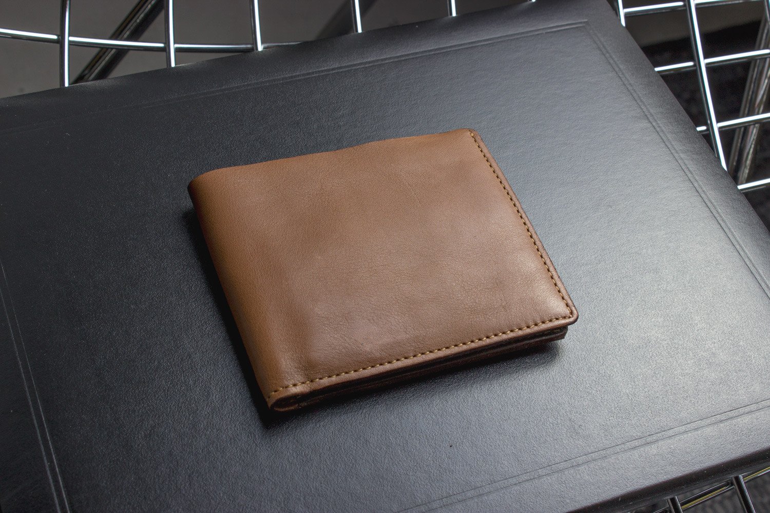 A stylish Double Bifold Wallet made from soft cowhide leather, featuring a double bill compartment and six card slots.