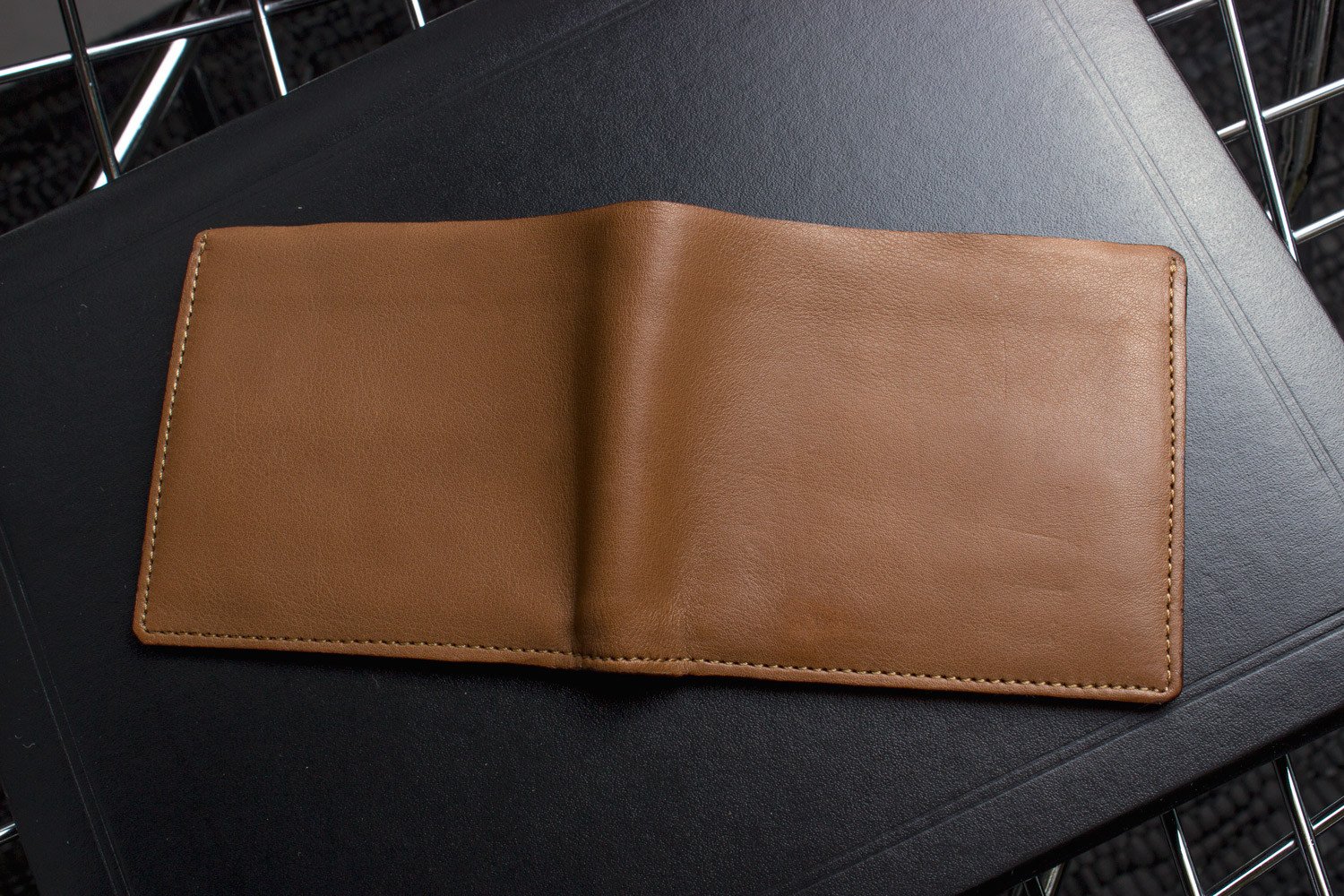 A stylish Double Bifold Wallet made from soft cowhide leather, featuring a double bill compartment and six card slots.