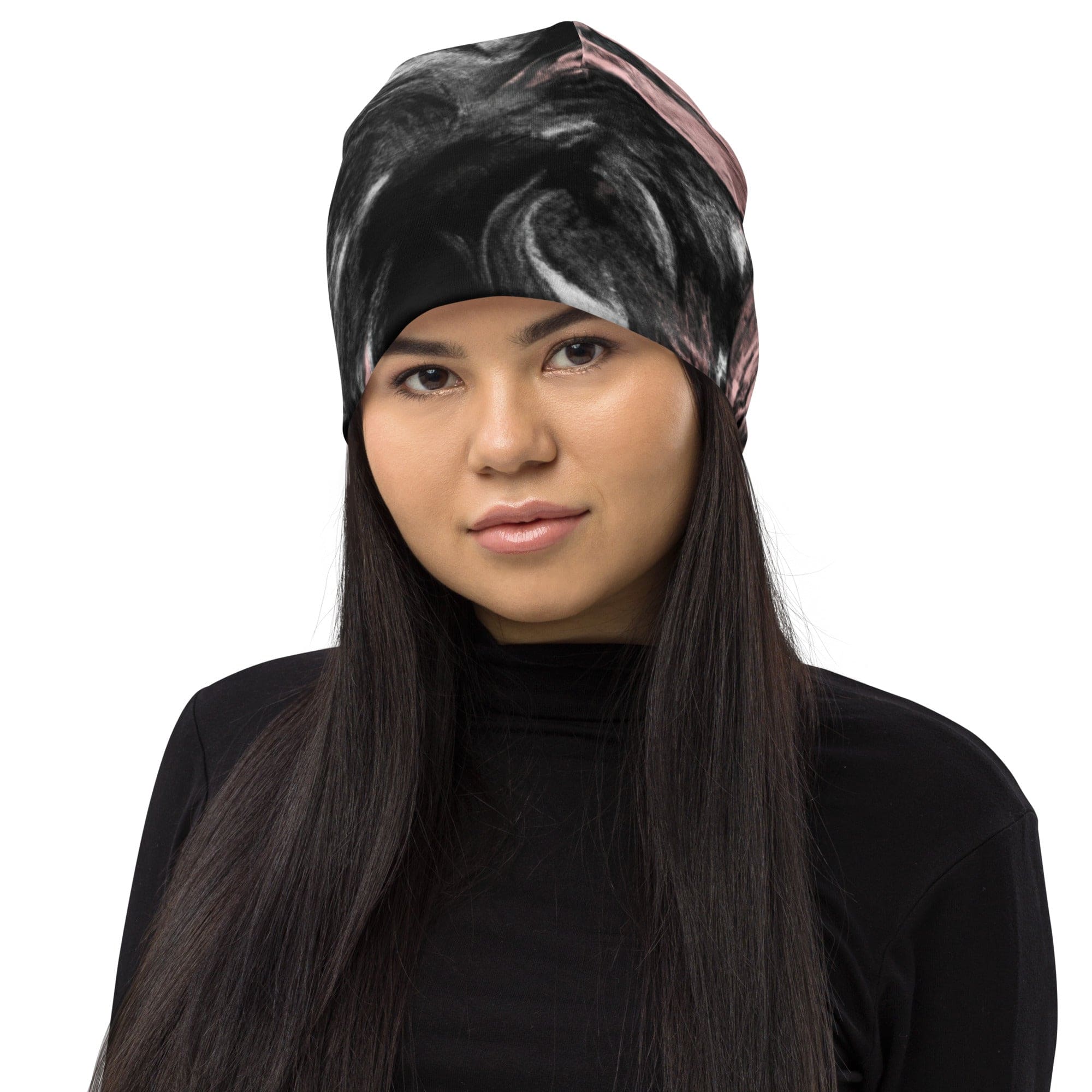 Double-layered beanie hat in black, pink, and white abstract pattern, showcasing its stylish design and soft fabric.