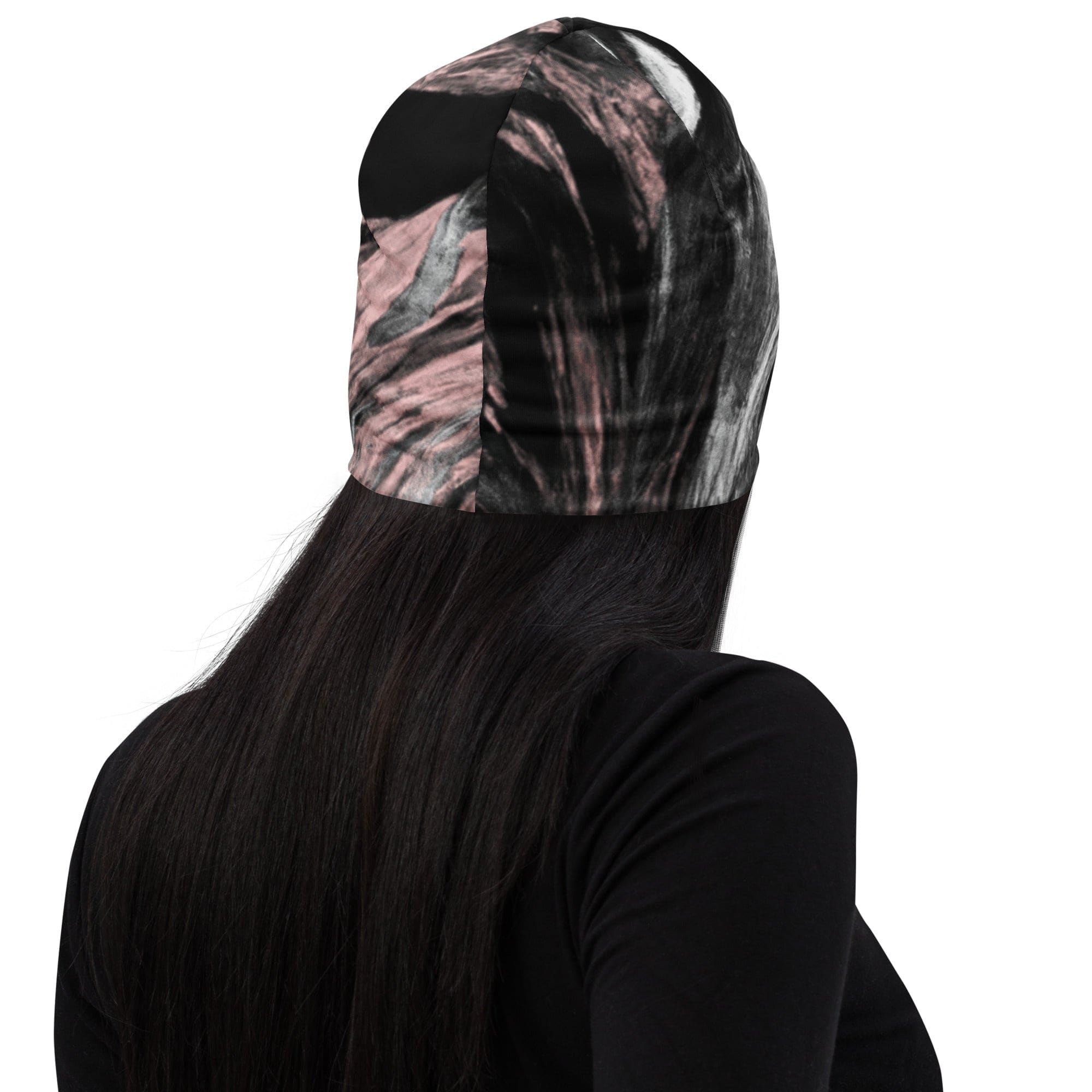 Double-layered beanie hat in black, pink, and white abstract pattern, showcasing its stylish design and soft fabric.