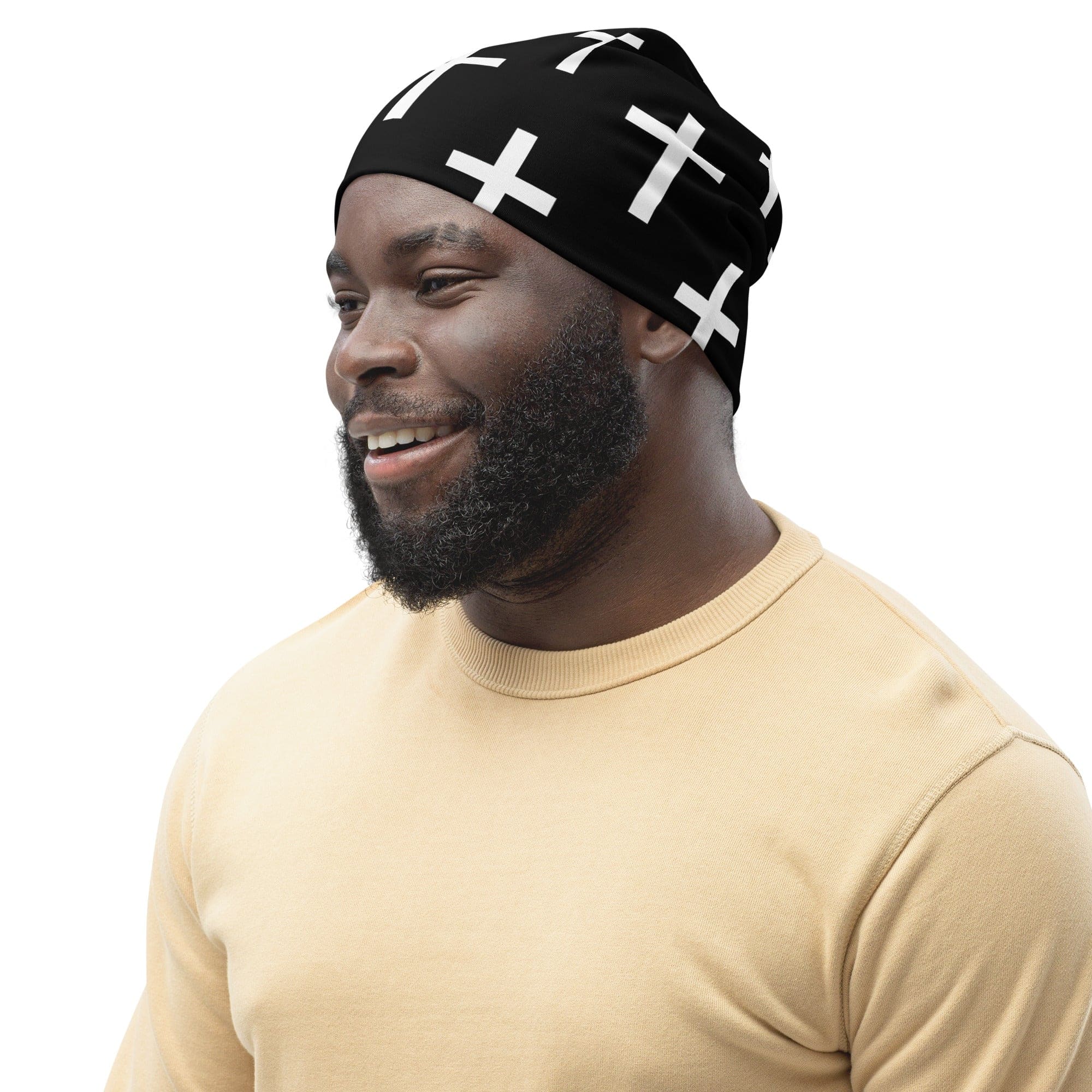 Double-layered beanie hat in black and white cross print, showcasing its soft fabric and stylish design.