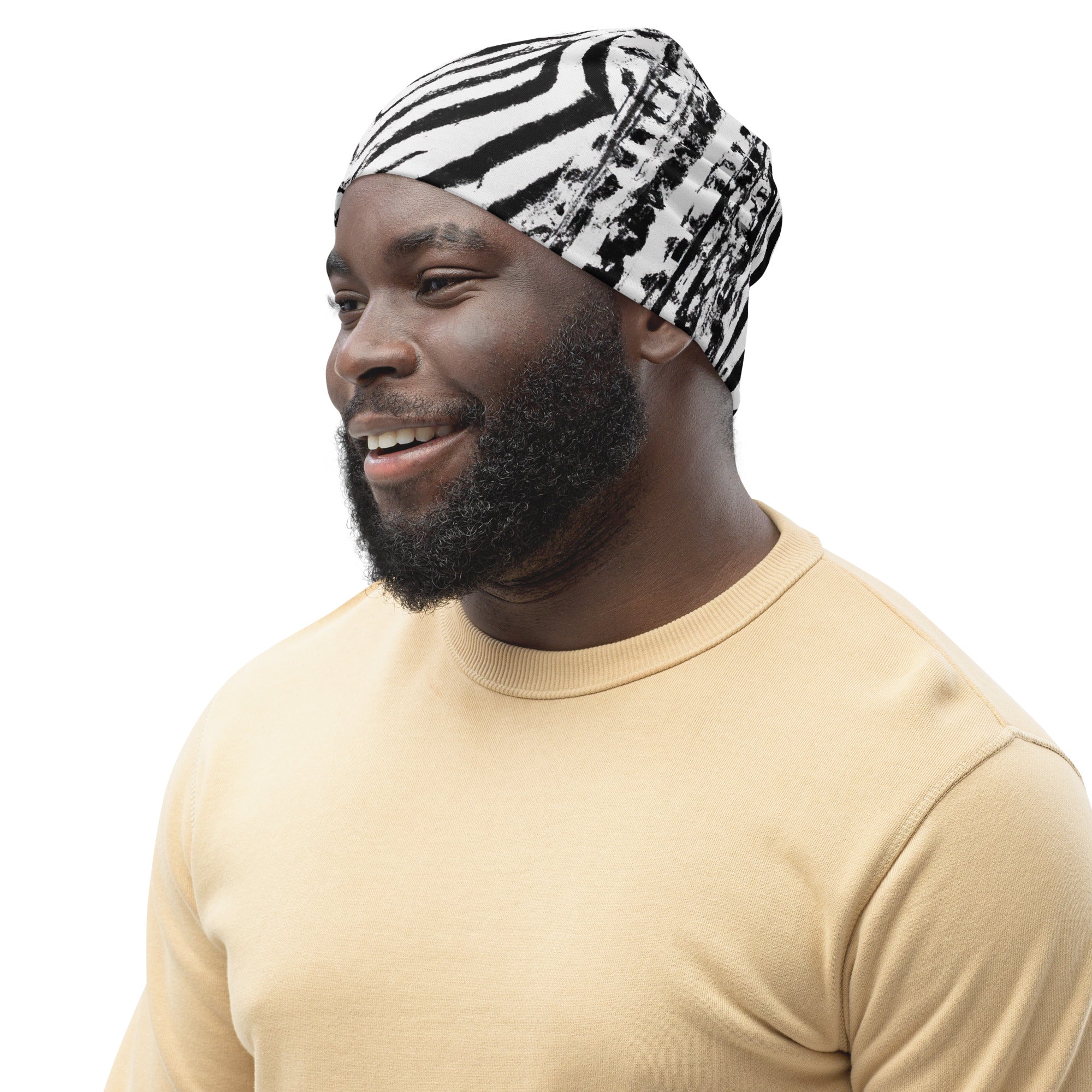 Double-layered beanie hat in black and white with native print design, showcasing its stylish and warm features.