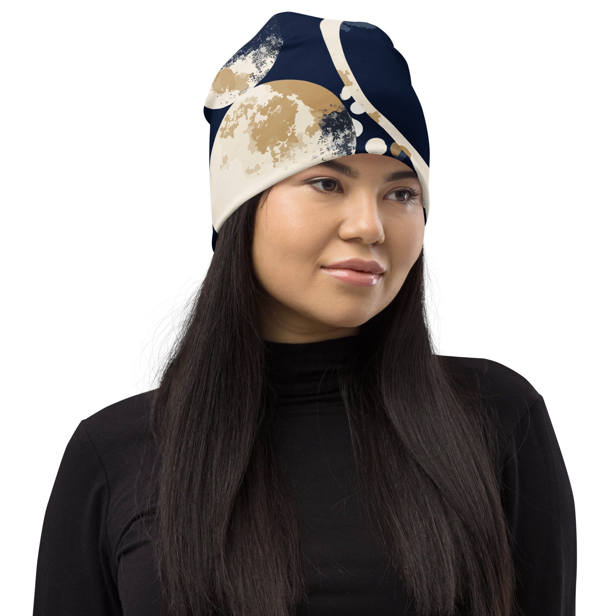 Double-layered beanie hat in blue and beige spotted print, showcasing its soft fabric and stylish design.