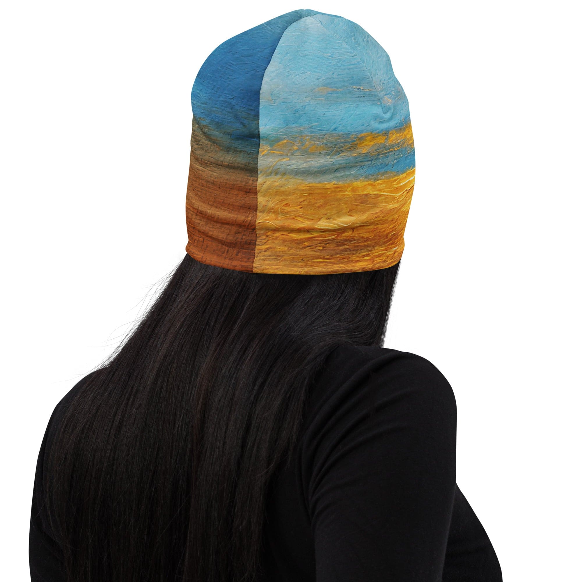 Double-layered beanie hat featuring a blue ocean and golden sunset print, perfect for winter and fall wear.