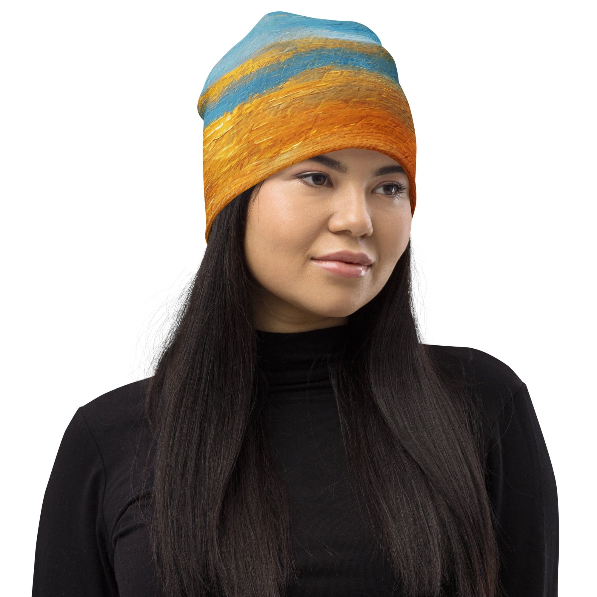 Double-layered beanie hat featuring a blue ocean and golden sunset print, perfect for winter and fall wear.