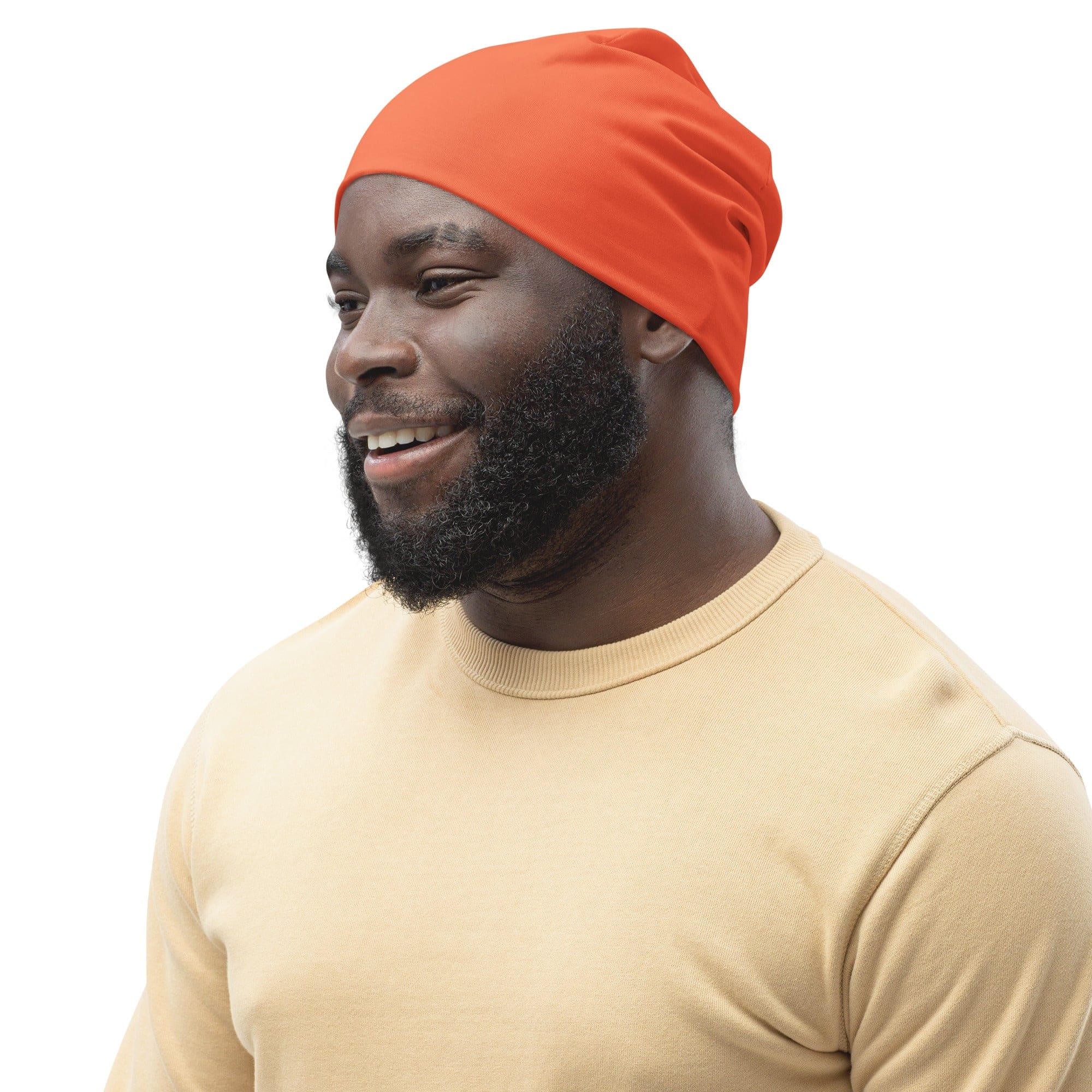 A vibrant coral orange red double-layered beanie hat, showcasing its soft fabric and stylish design, perfect for winter wear.