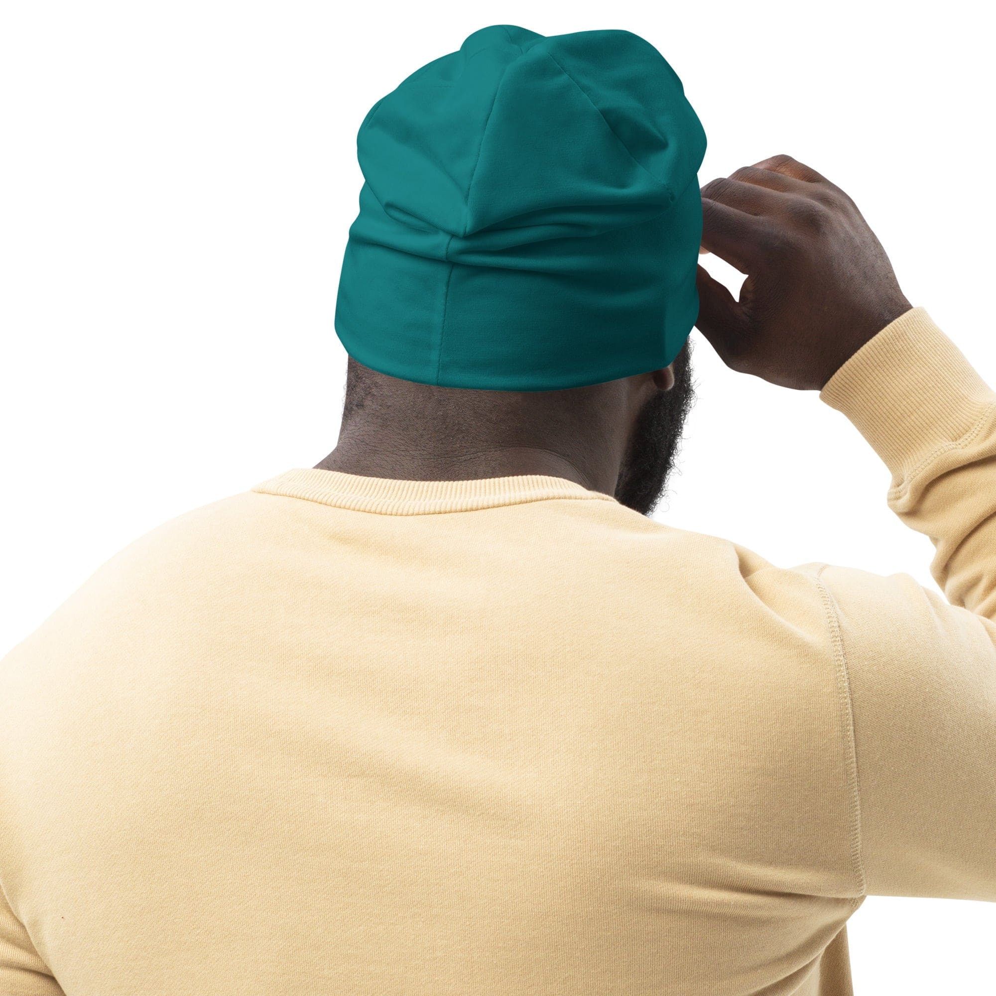 A cozy double-layered beanie hat in dark teal green, showcasing its soft fabric and stylish design.