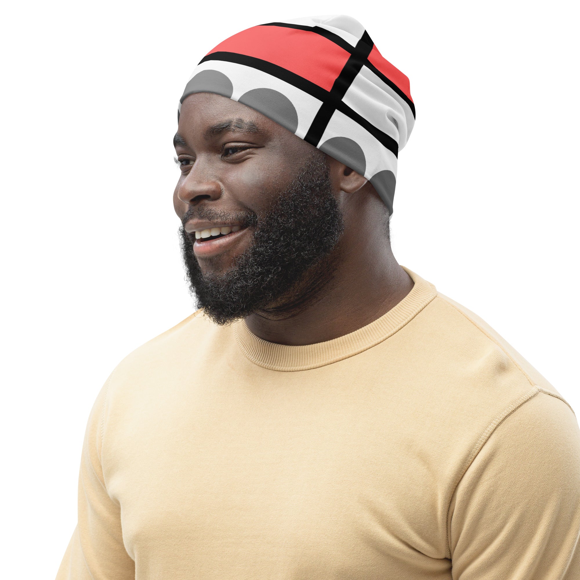 A stylish double-layered beanie hat in pale red print, showcasing its soft fabric and comfortable fit, perfect for chilly weather.