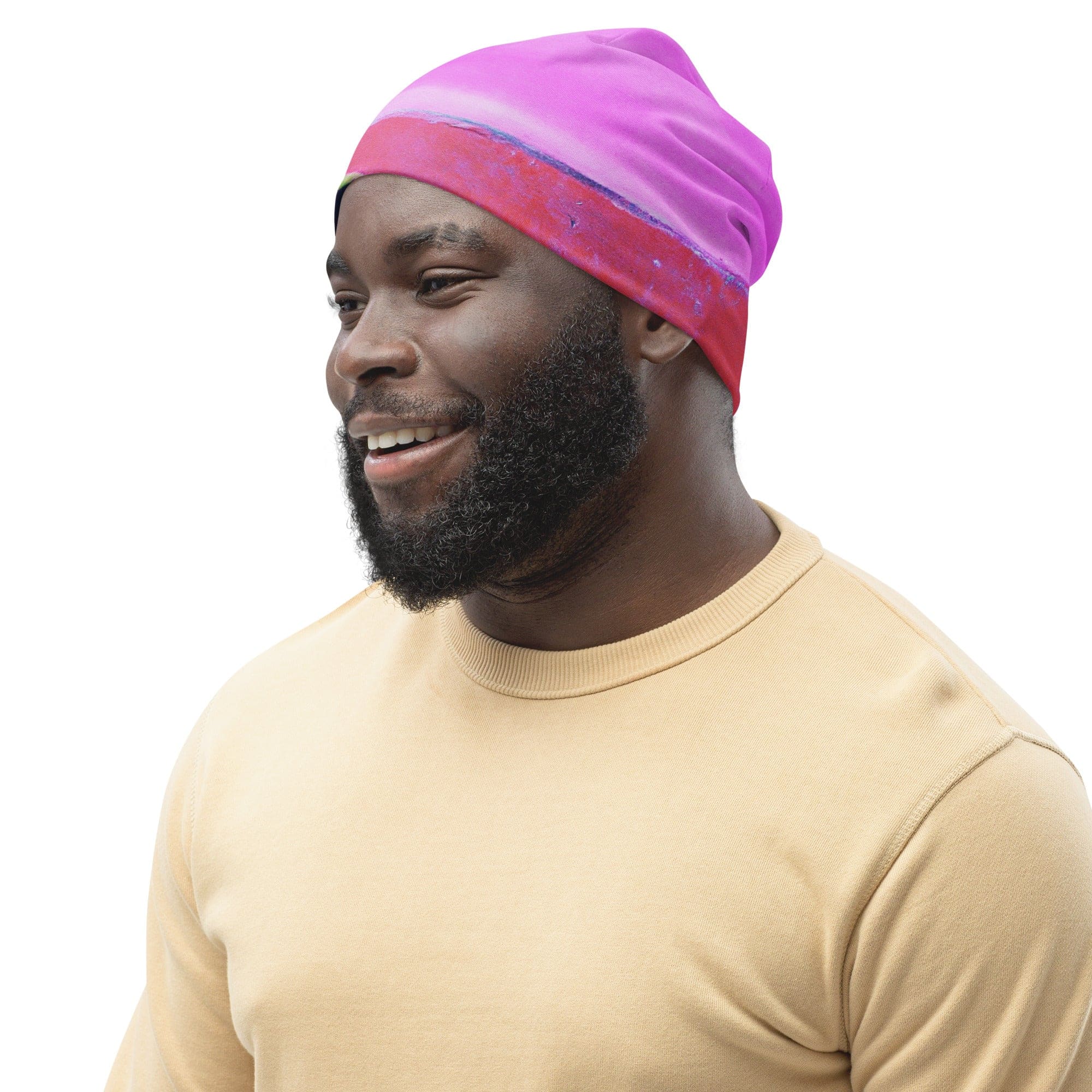 Double-layered beanie hat featuring a vibrant pink and purple pattern, perfect for winter and stylish outfits.