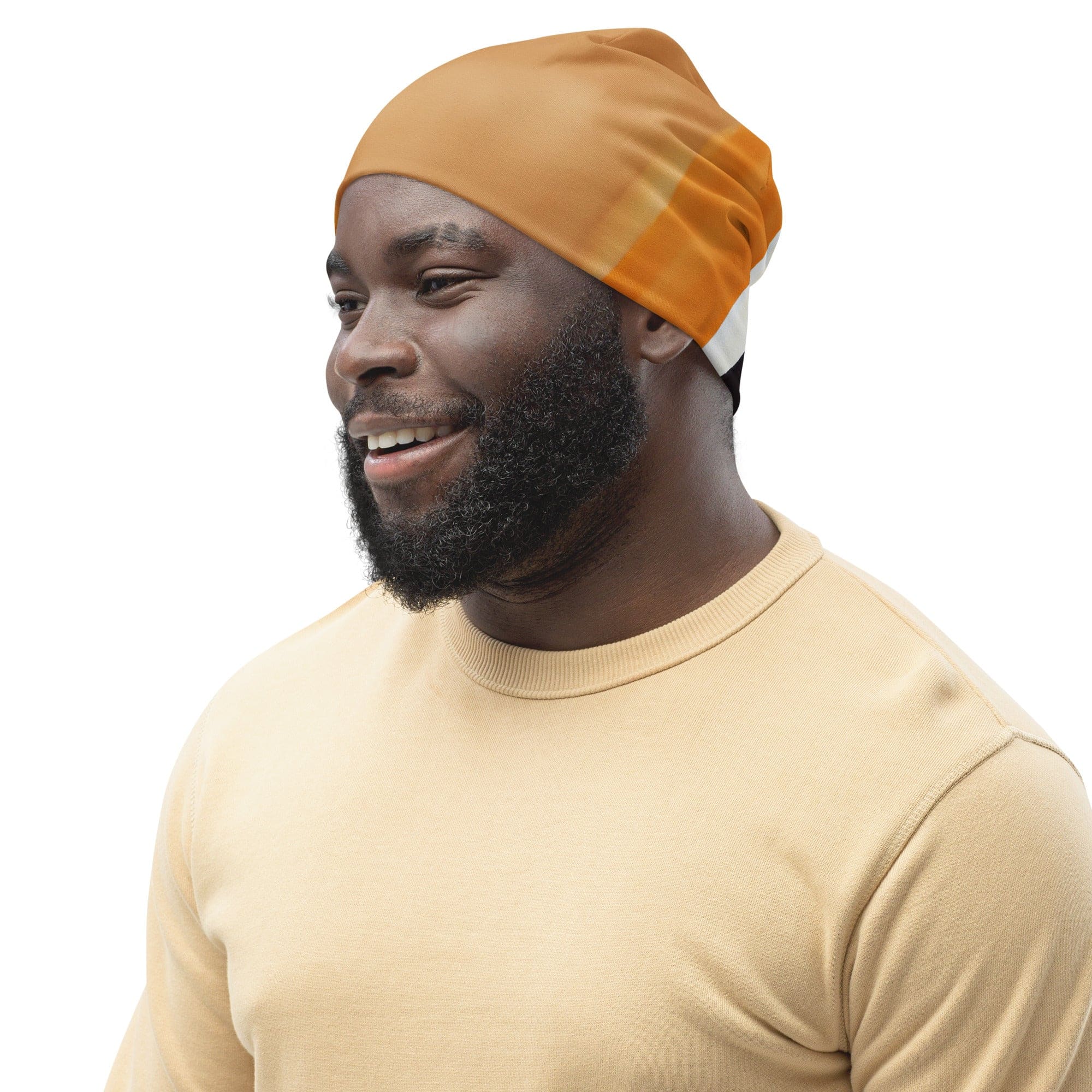 A double-layered beanie hat featuring a vibrant yellow and brown abstract pattern, perfect for winter and stylish outfits.