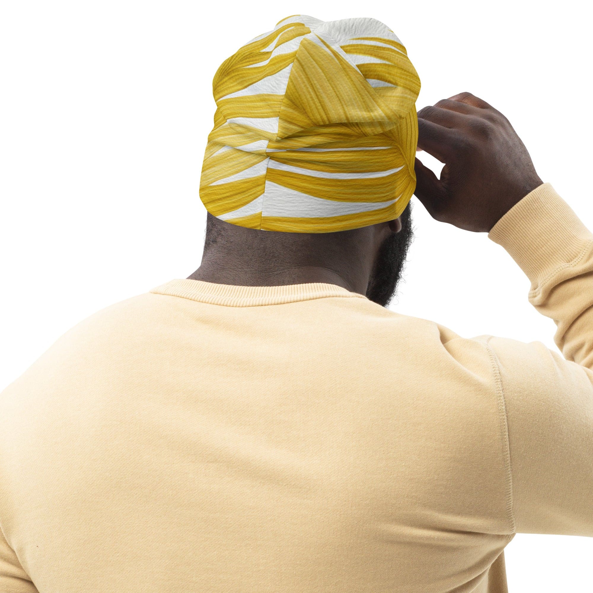 Double-layered beanie hat in yellow with palm leaves pattern, showcasing its soft fabric and stylish design.