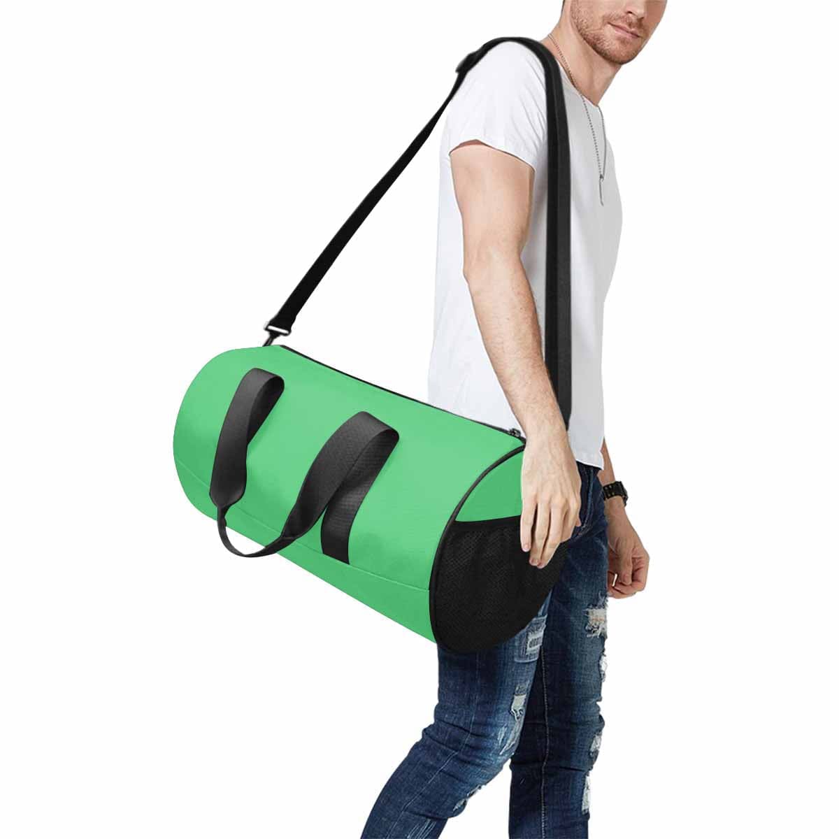 Emerald Green Duffel Bag designed for travel and outdoor activities, featuring waterproof fabric and spacious compartments.