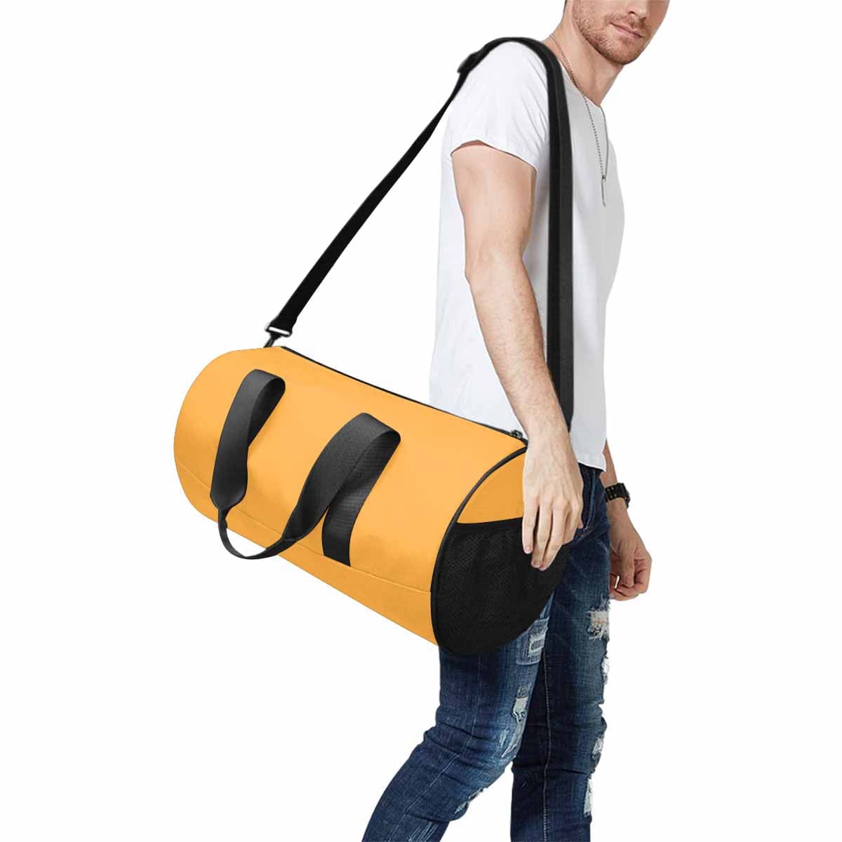 A vibrant yellow-orange duffel bag designed for travel and outdoor activities, featuring multiple pockets and a sturdy strap.