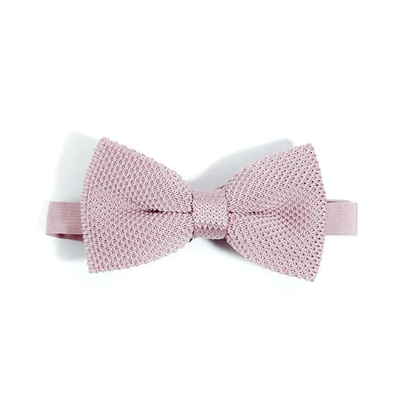 Dusty pink knitted bow tie displayed elegantly, showcasing its soft texture and unique design.