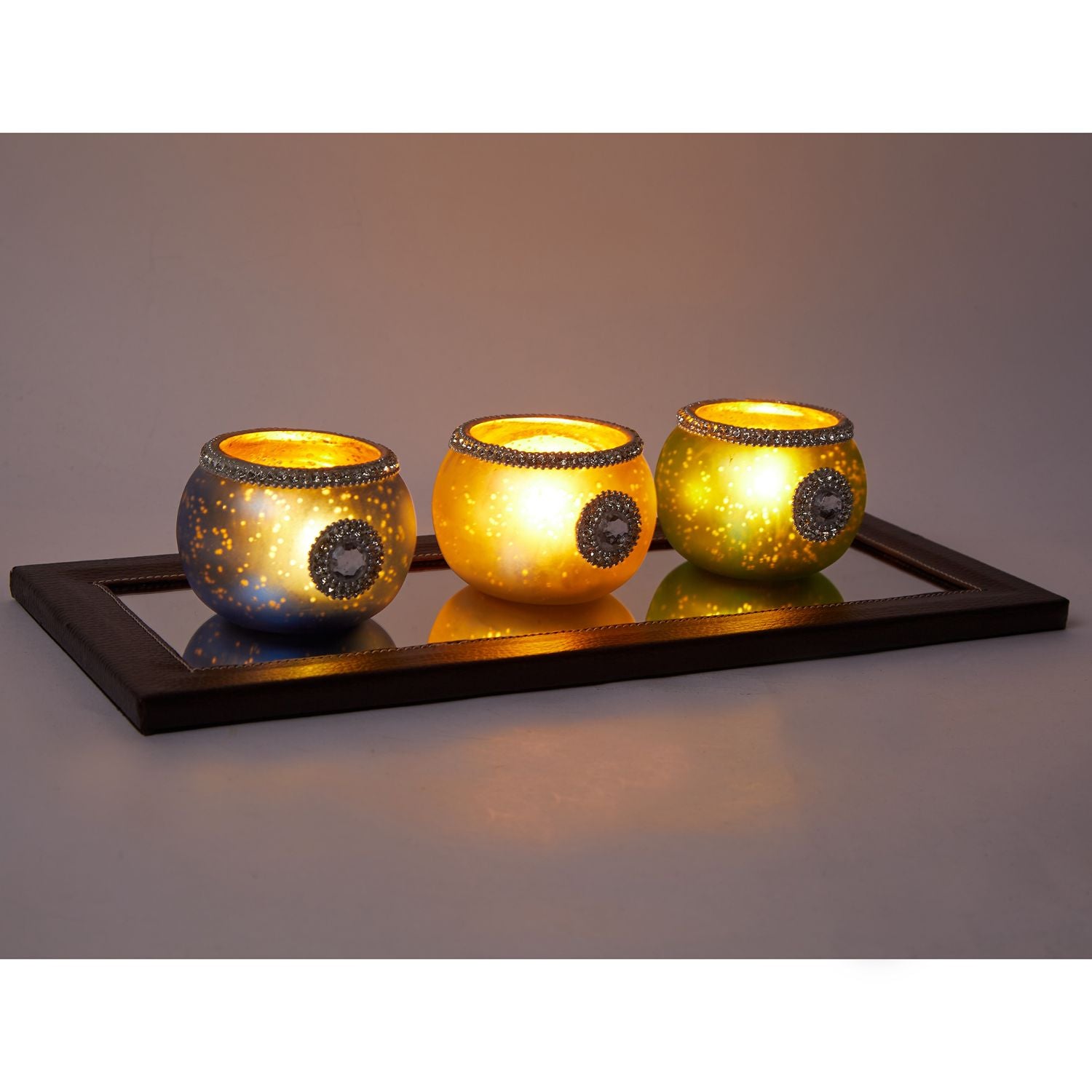 East Village Glass Mirror Tray with faux leather edges, elegantly displaying candle holders.