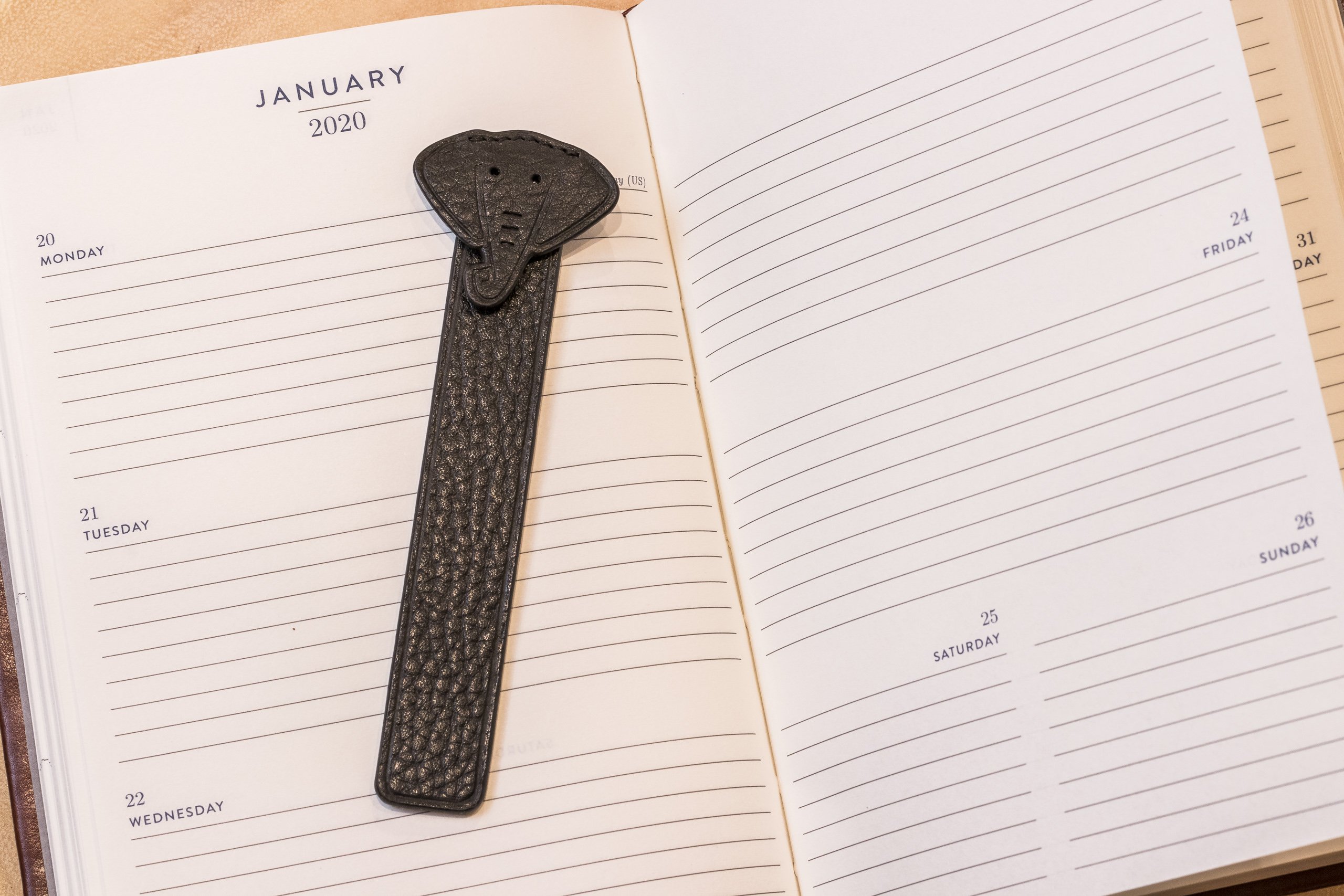 A stylish Elephant Bookmark made from genuine pebble leather featuring a unique elephant head design.