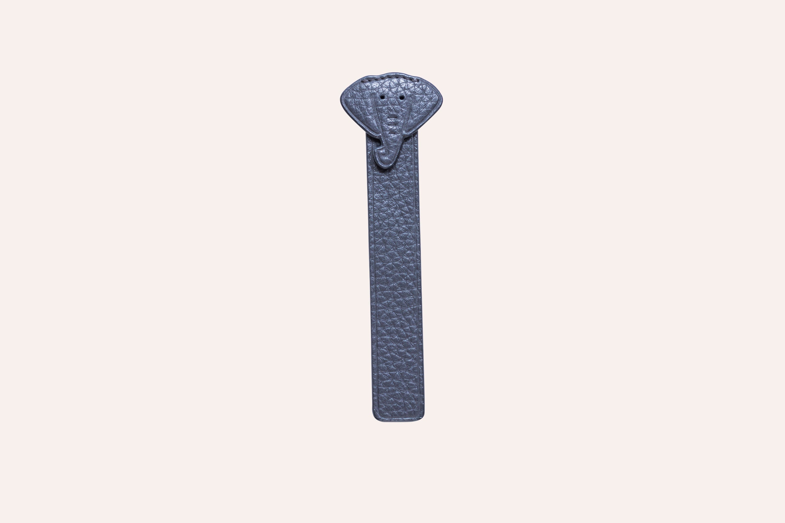 A stylish Elephant Bookmark made from genuine pebble leather featuring a unique elephant head design.