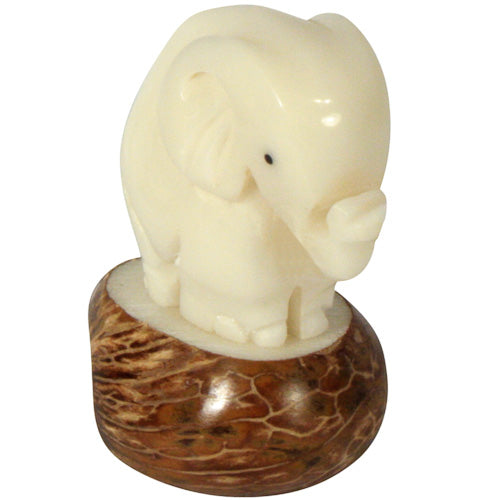 Hand-carved Elephant figurine made from tagua nuts, showcasing natural colors and intricate details, symbolizing eco-friendly craftsmanship.