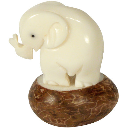 Hand-carved Elephant figurine made from tagua nuts, showcasing natural colors and intricate details, symbolizing eco-friendly craftsmanship.