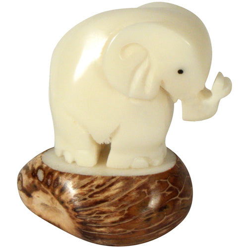 Hand-carved Elephant figurine made from tagua nuts, showcasing natural colors and intricate details, symbolizing eco-friendly craftsmanship.