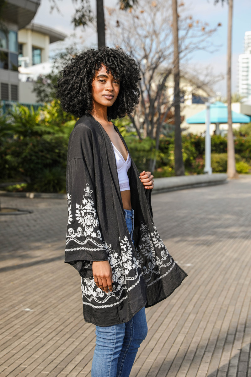 A light and airy embroidered floral vine kimono, showcasing intricate flower designs on a soft fabric, perfect for casual or elegant occasions.