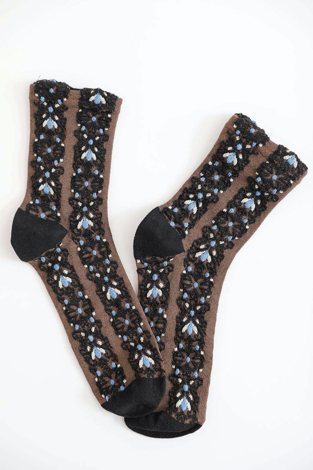 A pair of cozy socks featuring an embroidered flower pattern, showcasing vibrant colors and intricate details.