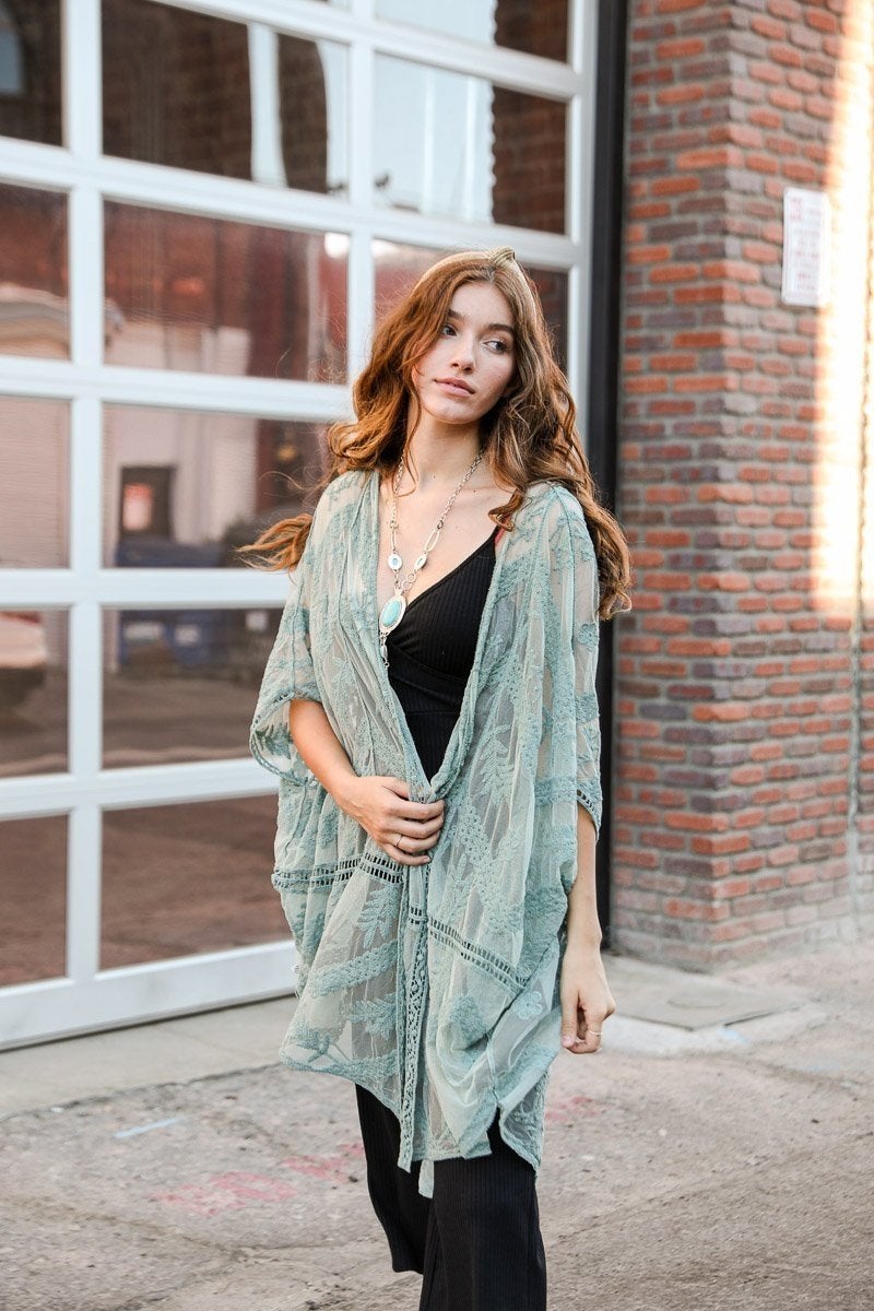 A lightweight embroidered mesh leaf kimono in various colors, perfect for spring and summer outfits, featuring intricate leaf patterns.