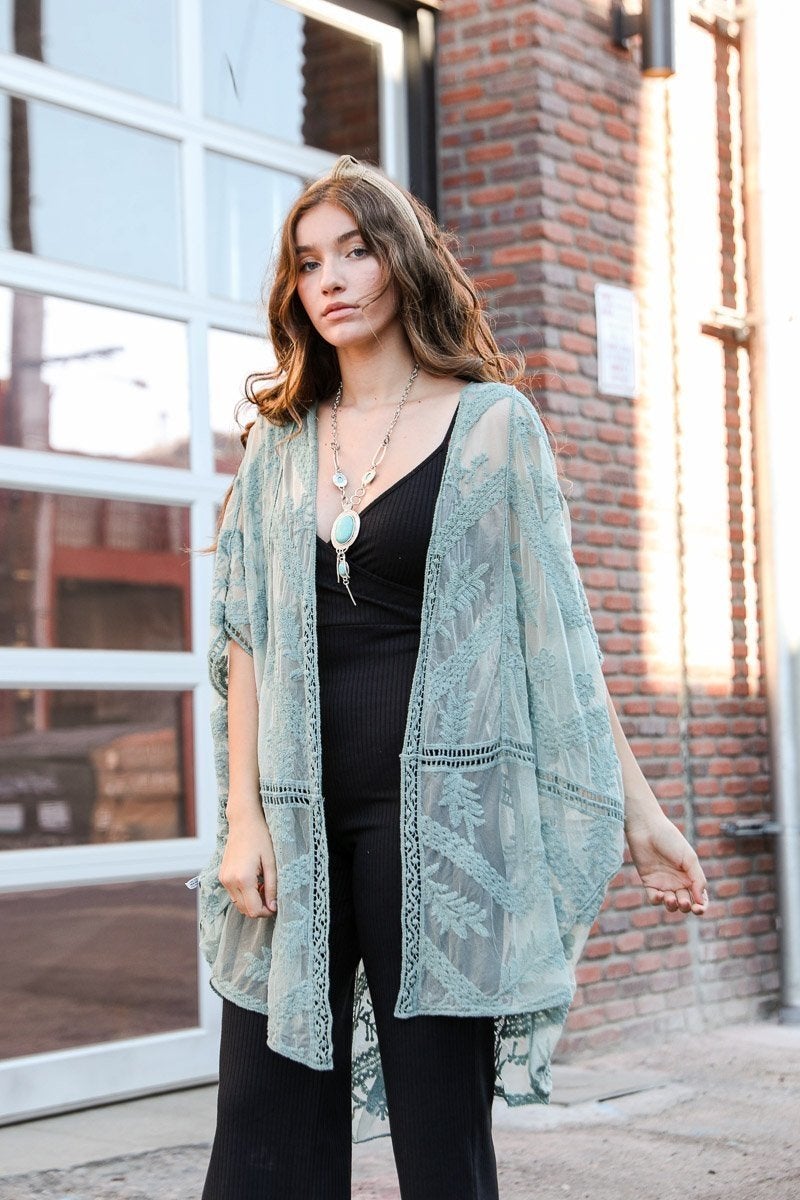 A lightweight embroidered mesh leaf kimono in various colors, perfect for spring and summer outfits, featuring intricate leaf patterns.