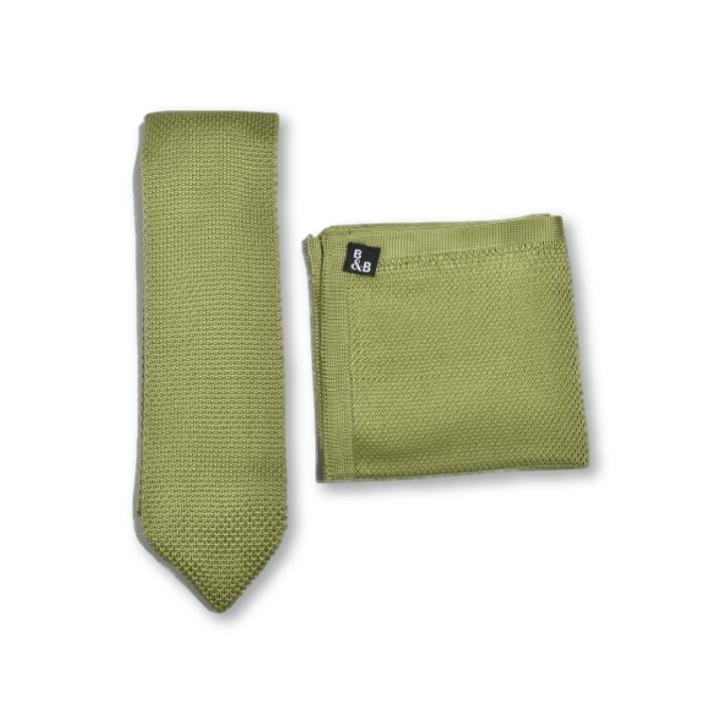 Emerald green knitted tie and pocket square set displayed elegantly, showcasing the texture and color.