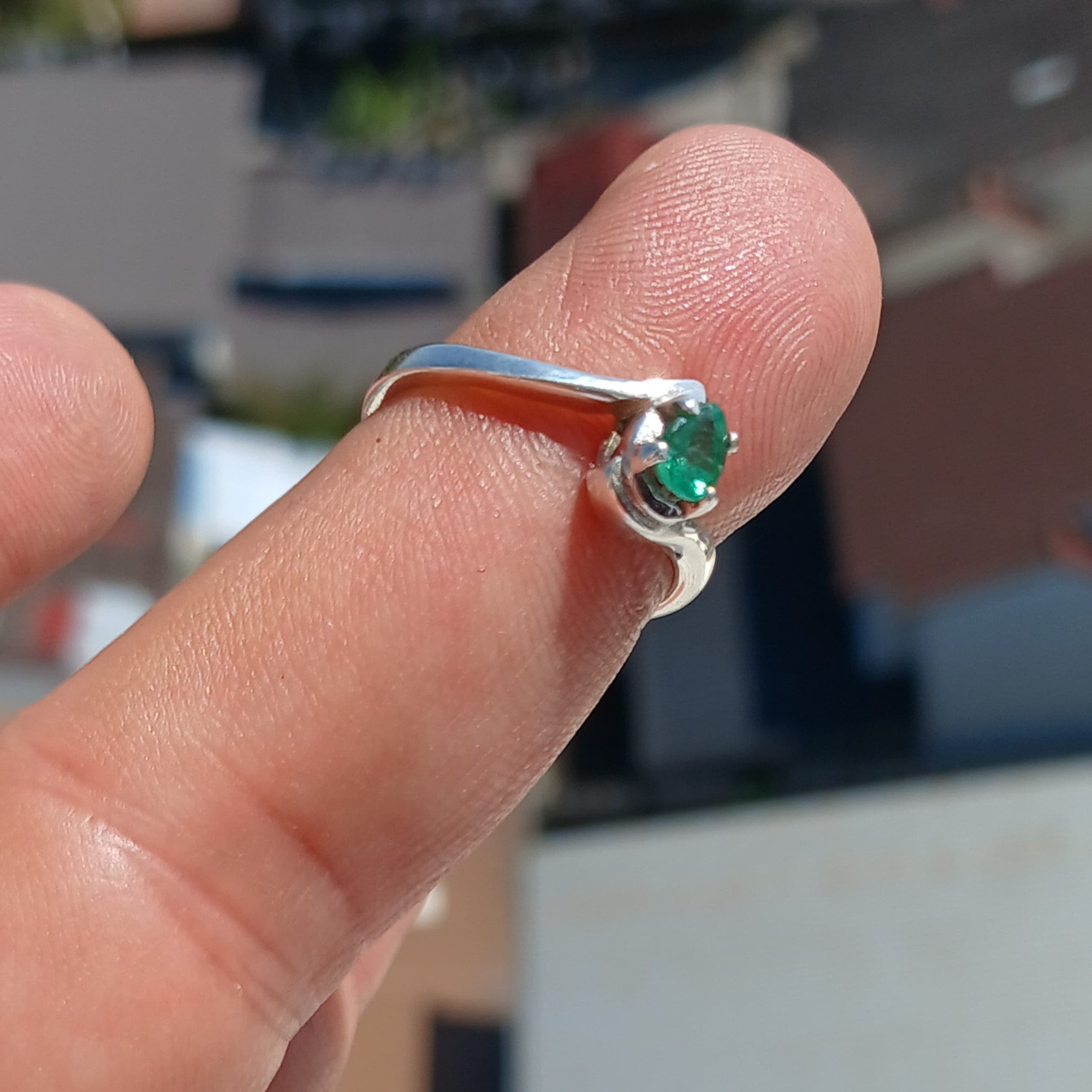 Handmade Sterling Silver Emerald Ring featuring a natural green Pear Shaped Emerald, showcasing its elegant design and craftsmanship.