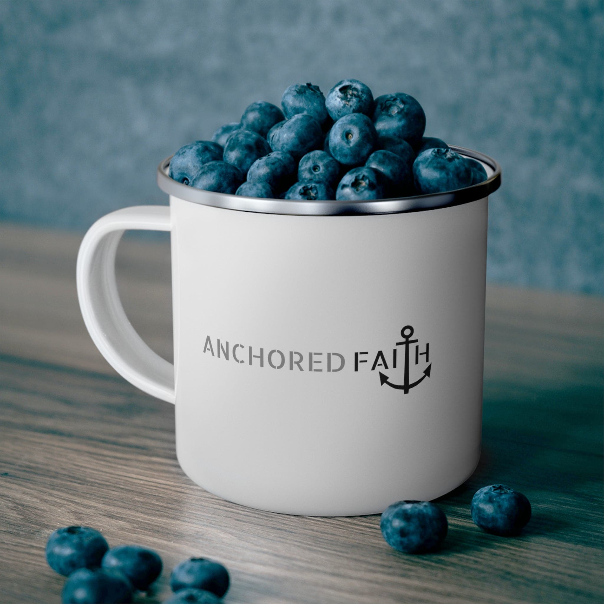 Durable enamel camping mug featuring an Anchored Faith inspirational illustration, perfect for outdoor and indoor use.