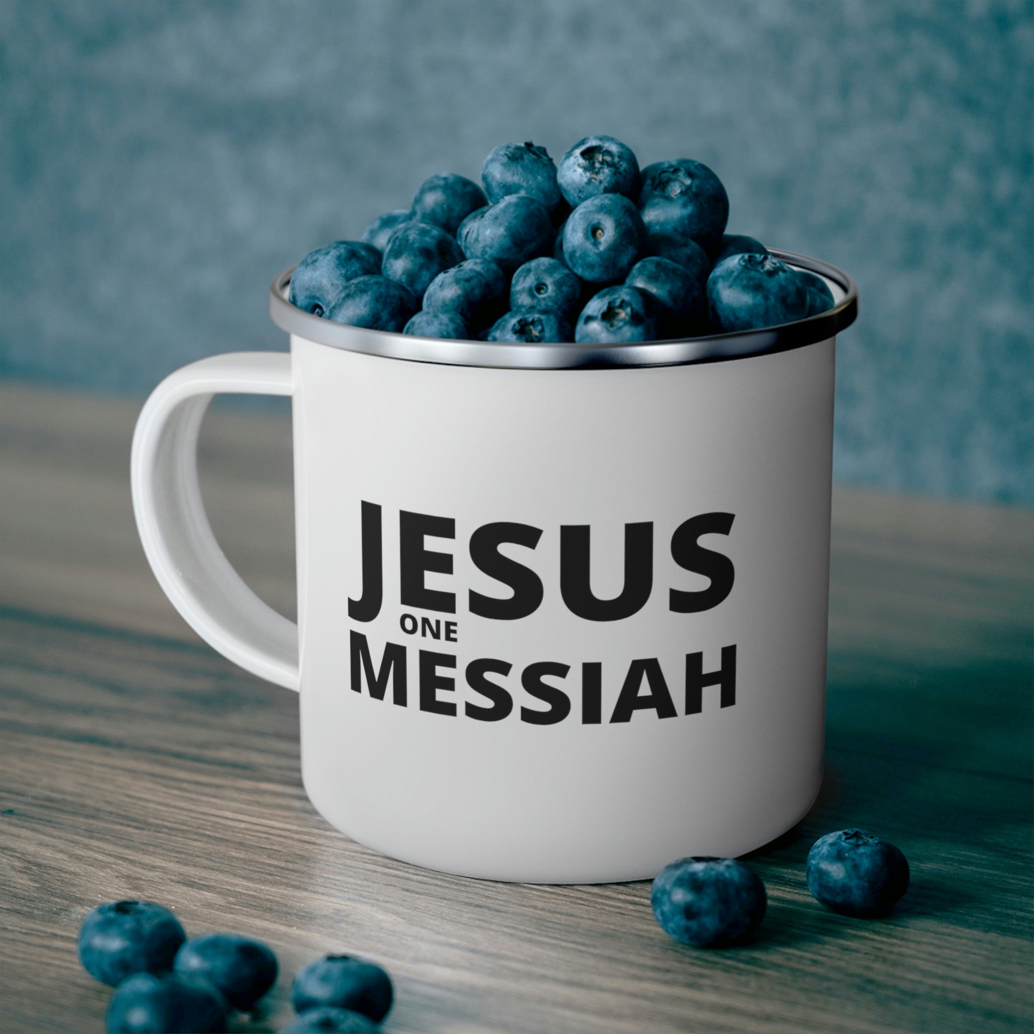 Durable enamel camping mug featuring a black illustration of Jesus, perfect for outdoor and indoor use.