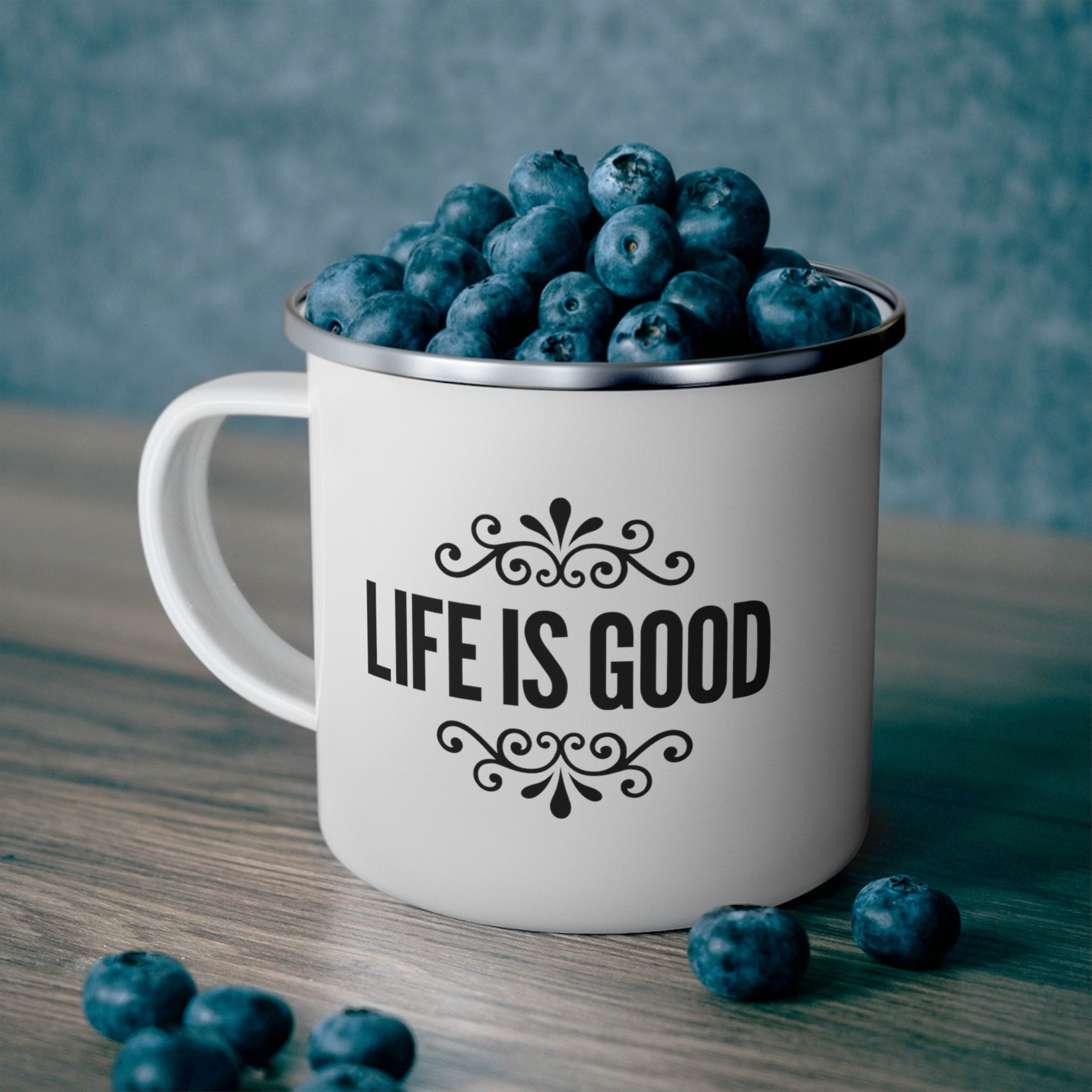 Life is Good Enamel Camping Mug with black graphic illustration, featuring a durable stainless steel body and C-handle design.