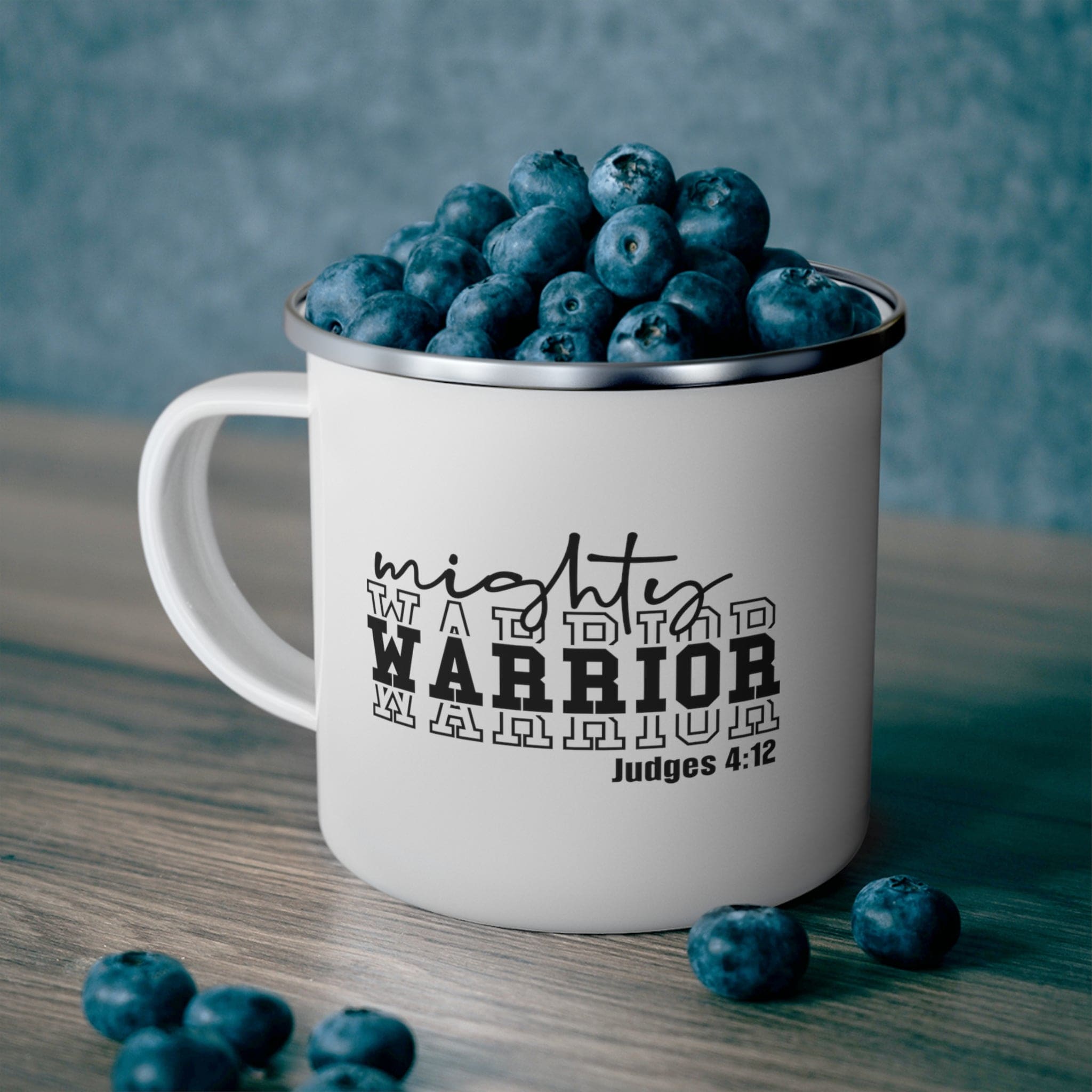 Mighty Warrior Enamel Camping Mug featuring a black warrior illustration, durable stainless steel, and a comfortable C-handle.