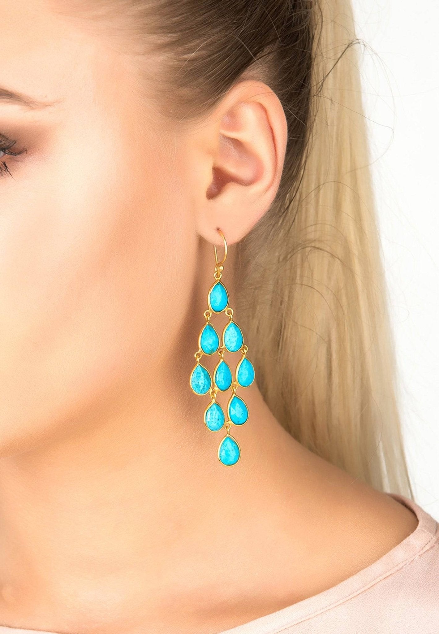 Erviola Gemstone Cascade Earrings featuring turquoise teardrop gemstones and gold accents, elegantly designed for versatile wear.