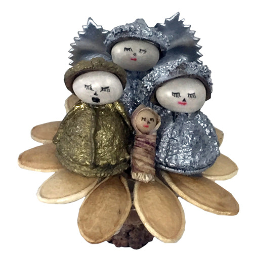 Eucalyptus and Pumpkin Seed Nativity featuring Mary, Joseph, and an angel with pasta wings, handmade in Ecuador.