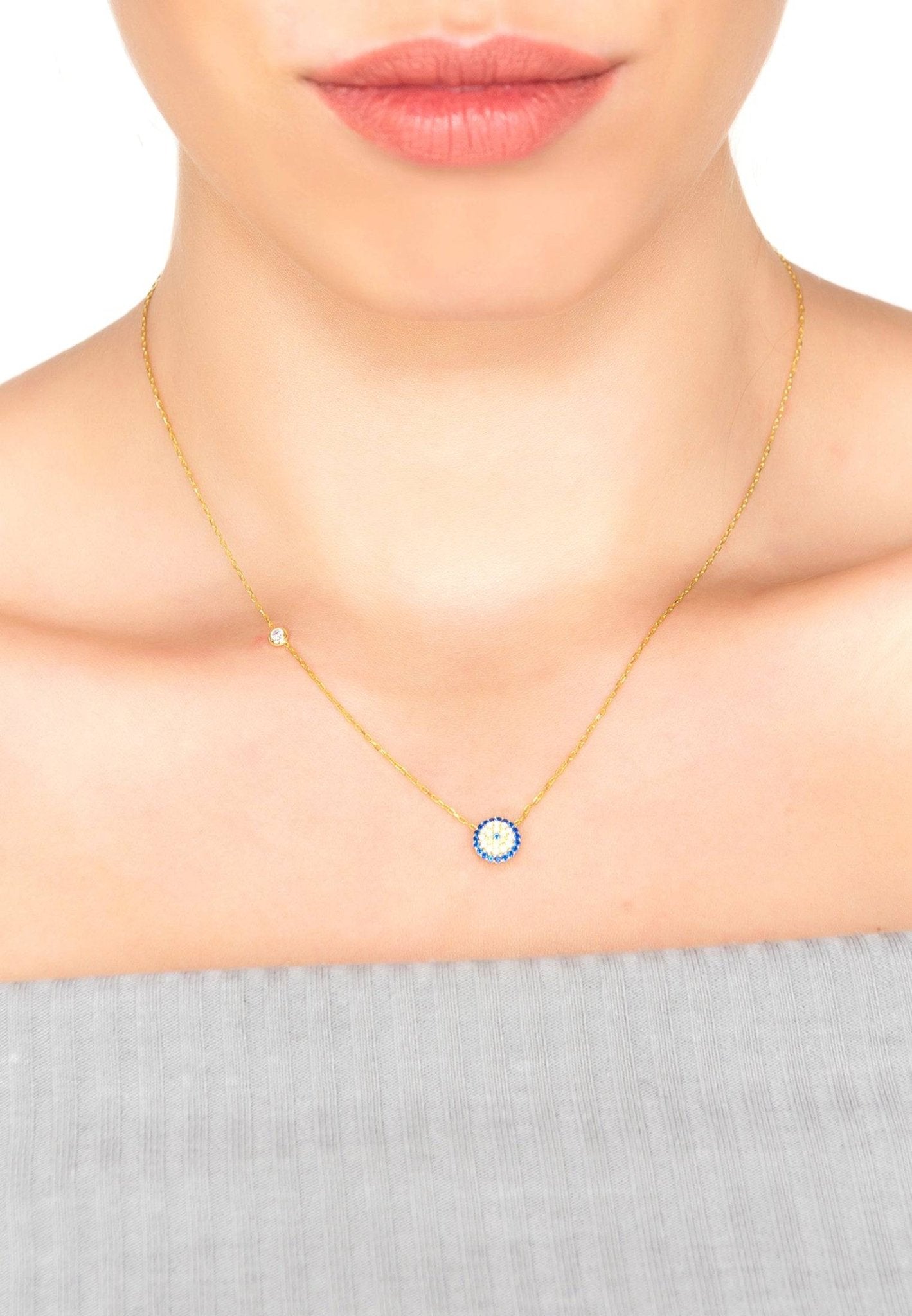 Elegant Evil Eye Necklace Gold with blue, white, and gold zircons, handcrafted from sterling silver and dipped in 22ct gold.