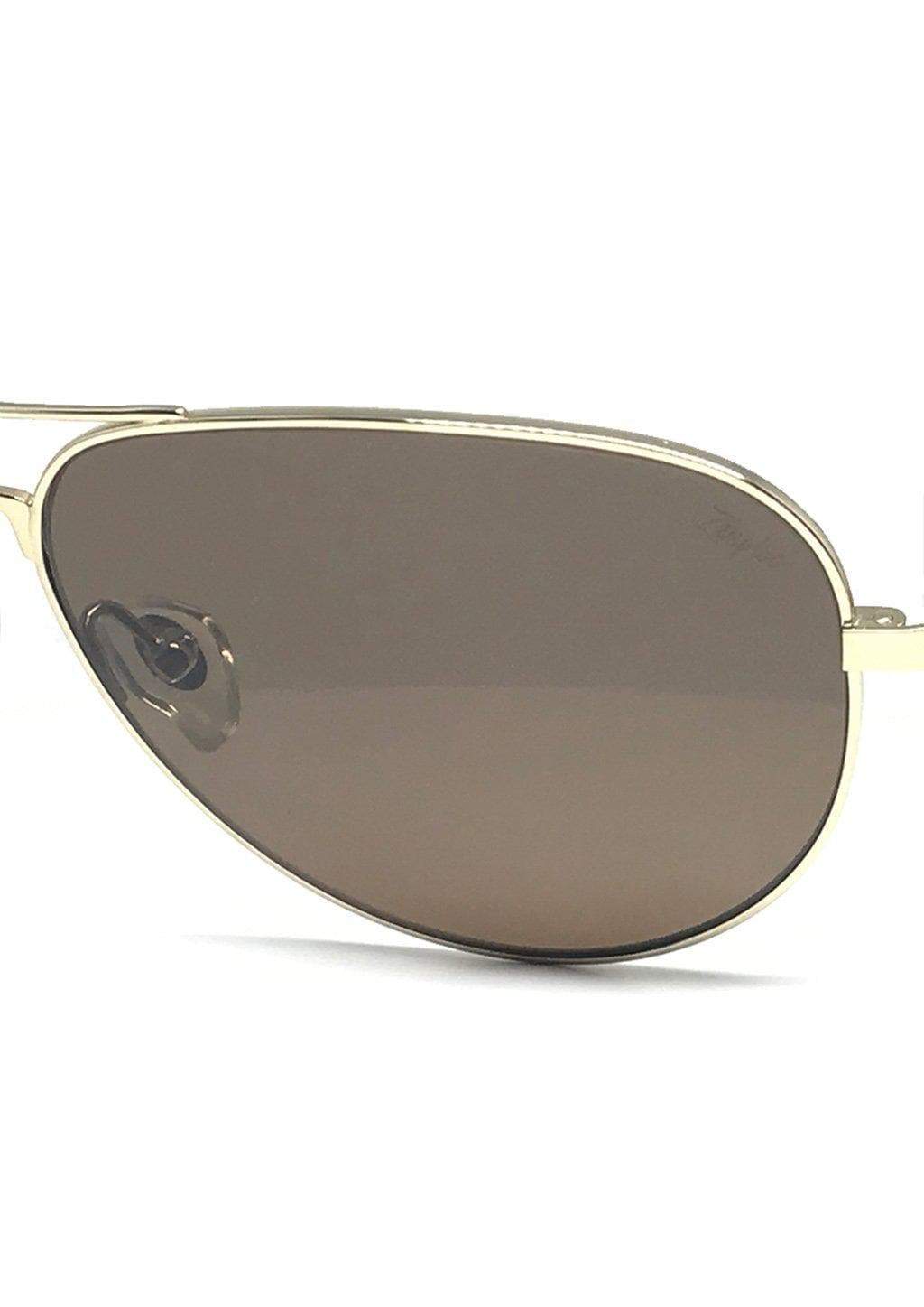 Close-up of aviator sunglasses lens.