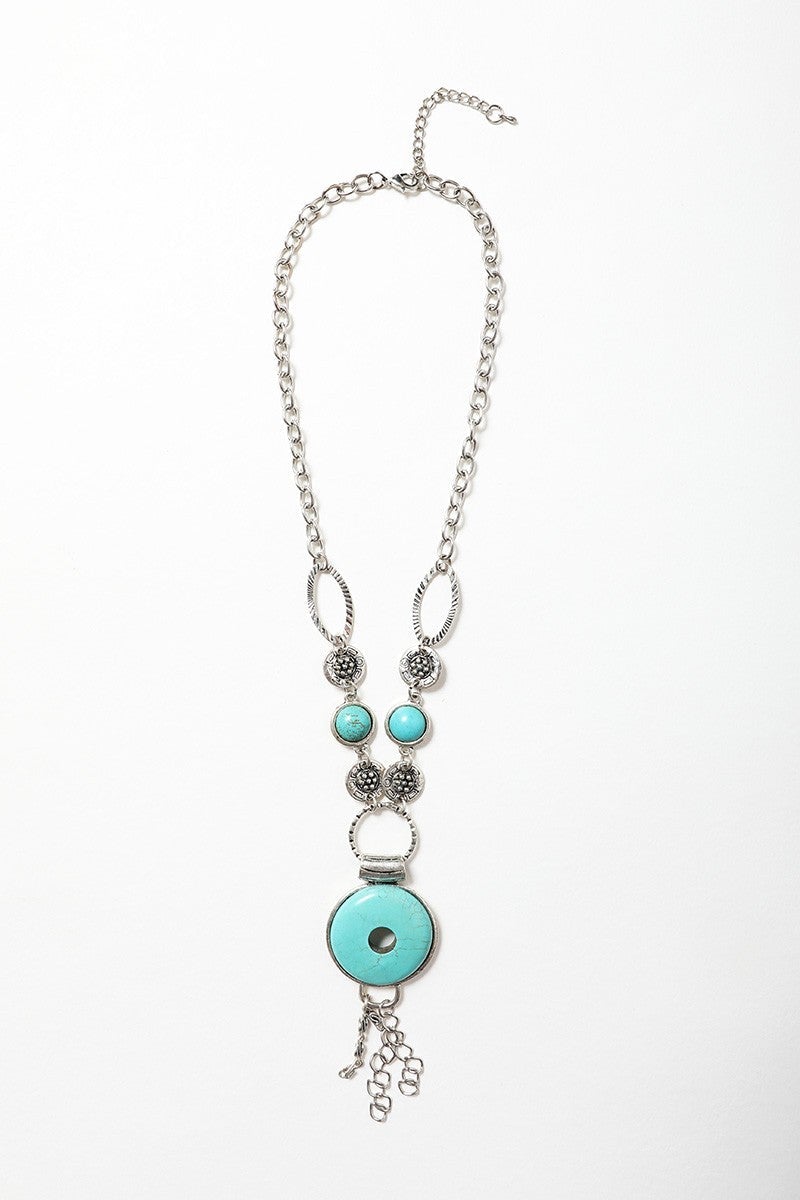 A beautiful Eyelet Turquoise Necklace featuring hand-cut turquoise stones, perfect for adding color to any outfit.