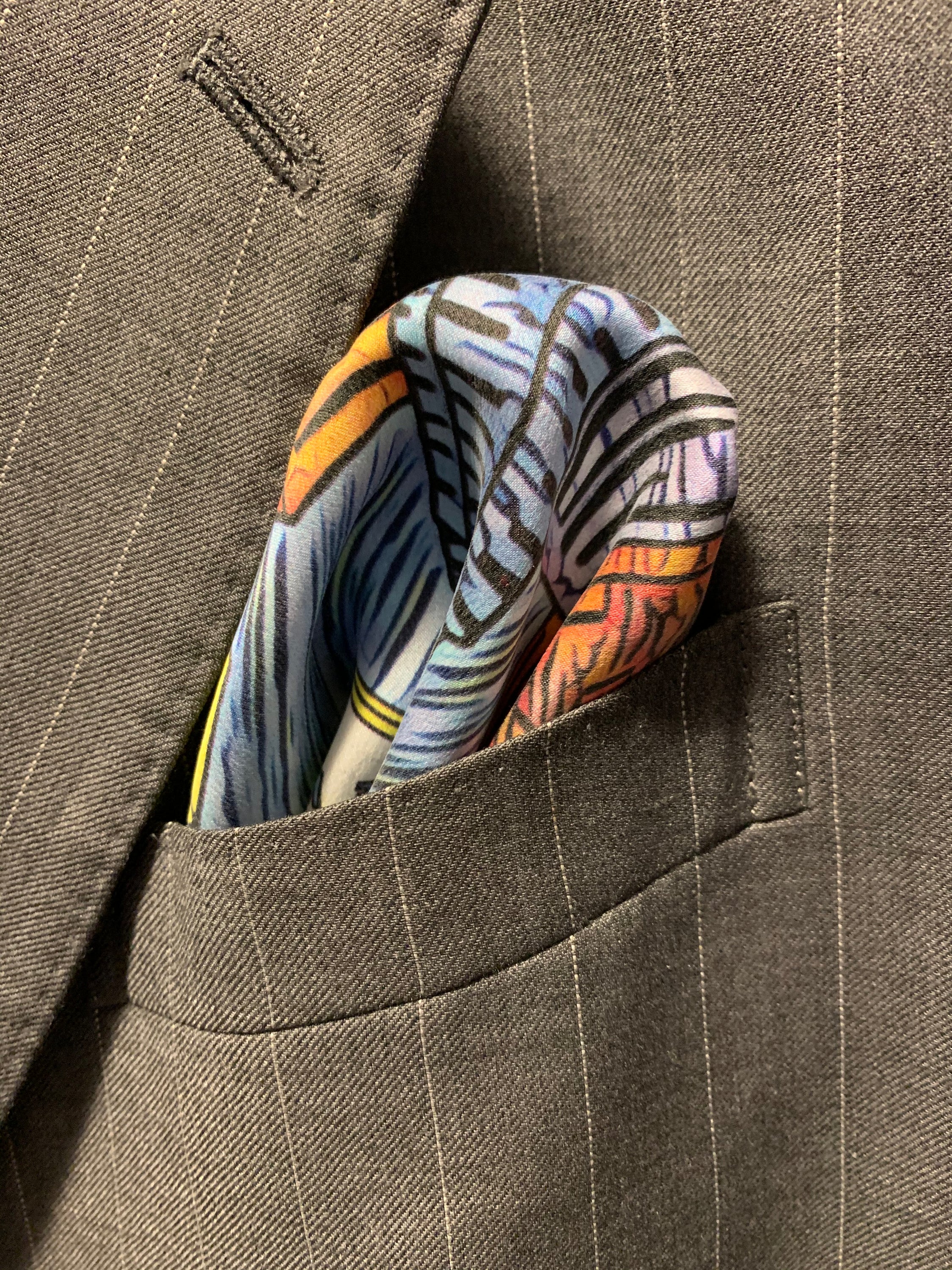 Fabulous Las Vegas Sky Blue Pocket Square featuring a hand-sketched design of the New York New York hotel in vibrant colors.